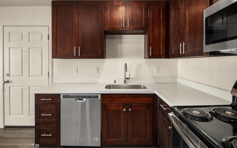 a kitchen with wooden cabinets