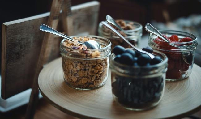 a table with food and a bowl of ice cream