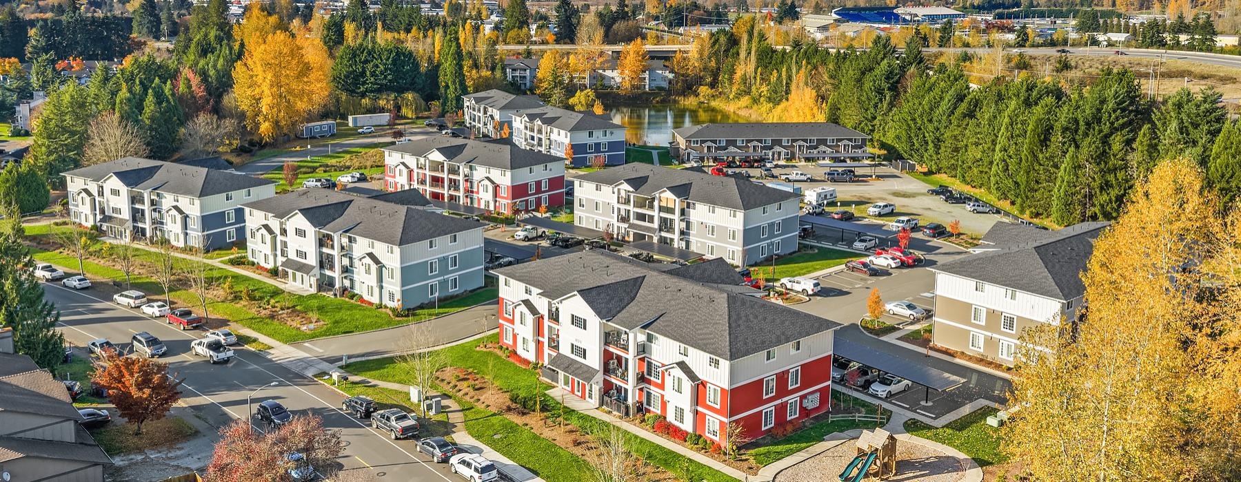 a group of buildings with trees around them