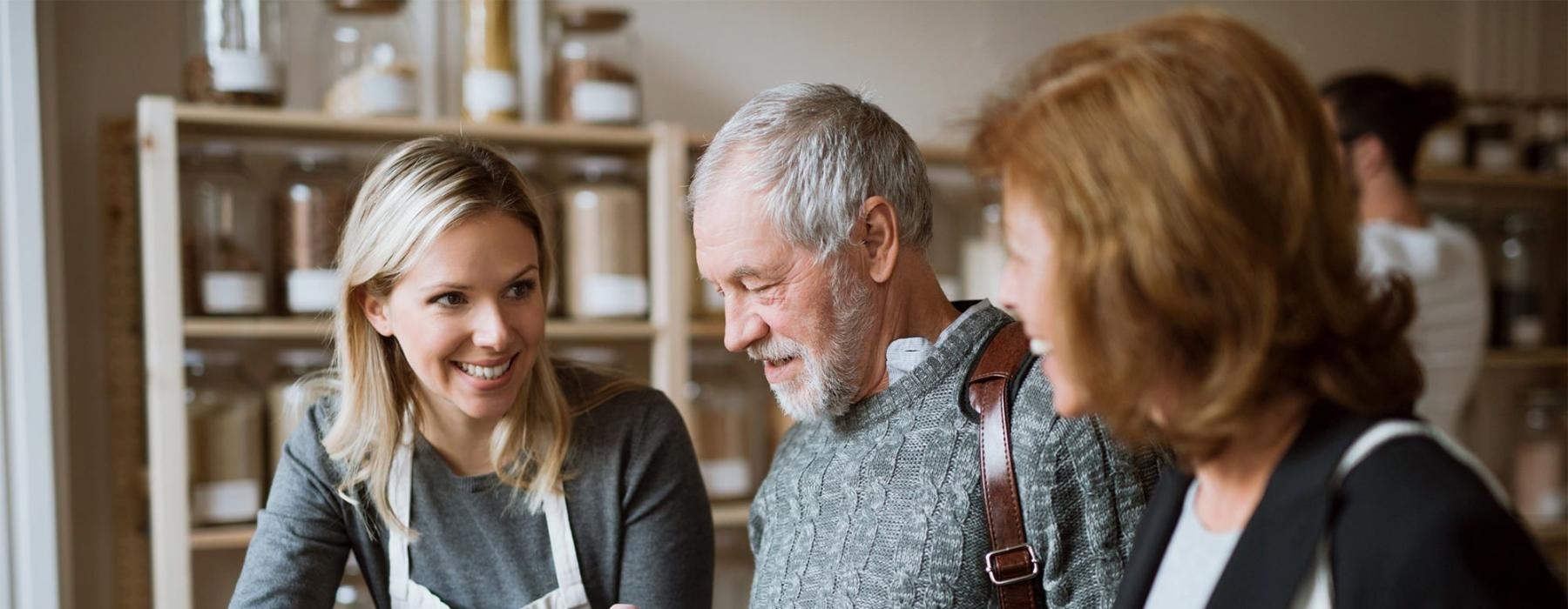 a few people looking at a paper